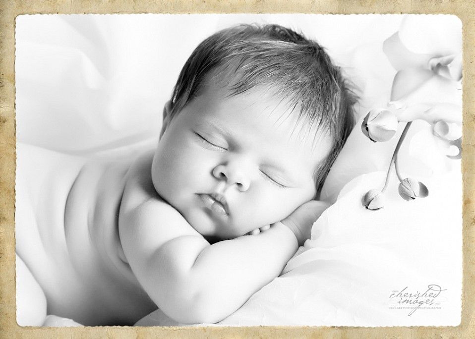 newborn baby in black and white