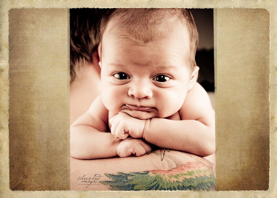 newborn baby on dads shoulder